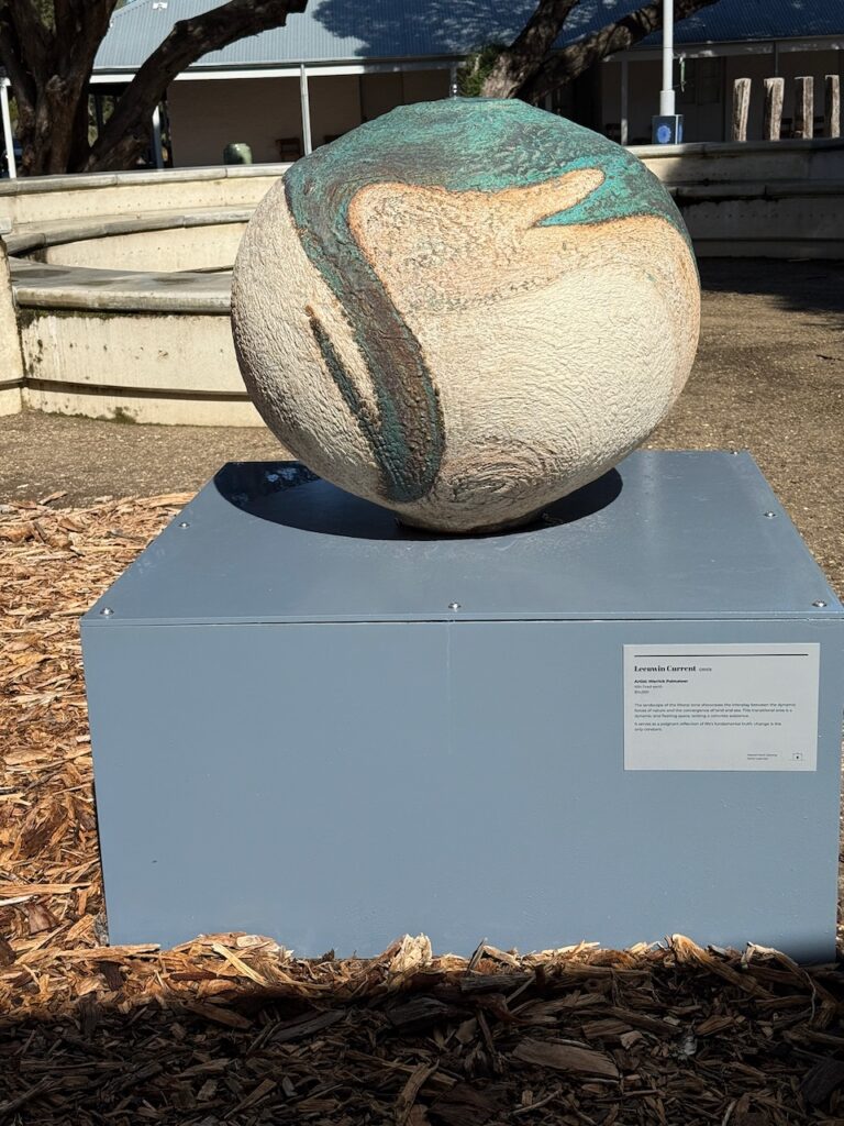 "Leewuwin Current" - a spherical vase sculpture outside the museum.Swirling blue and brown from the top overlays the cream body of the piece. The Leeuwin Current flows down from Indonesia, stimulating the growth of tropical coral around the island's marine gardens. This current also increases the water temperature by four degrees compared to the coast of Western Australia, expanding your experiences underwater.