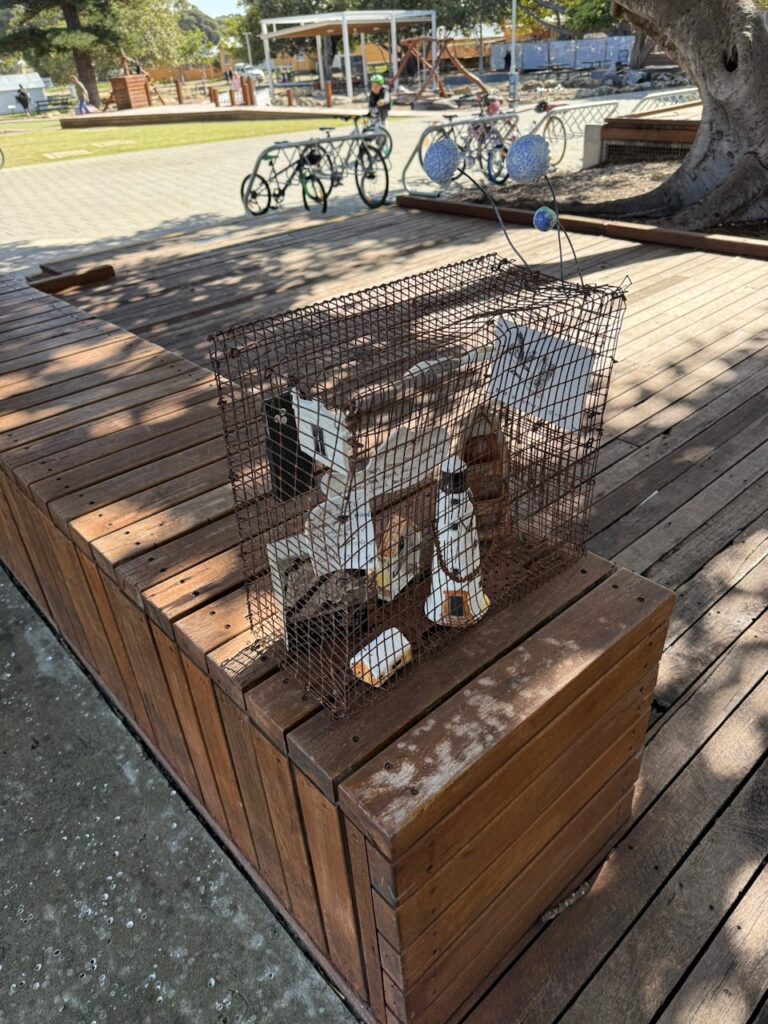 Artwork outside the museum, consisting of a wire mesh cage enclosing objects relating to the history of Rottnest Island