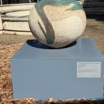 "Leewuwin Current" - a spherical vase sculpture outside the museum.Swirling blue and brown from the top overlays the cream body of the piece. The Leeuwin Current flows down from Indonesia, stimulating the growth of tropical coral around the island's marine gardens. This current also increases the water temperature by four degrees compared to the coast of Western Australia, expanding your experiences underwater.