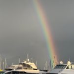 Zoom shot of rainbow in stormy skies above the marina at Hillary's Boat Harbour