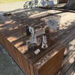 Artwork outside the museum, consisting of a wire mesh cage enclosing objects relating to the history of Rottnest Island